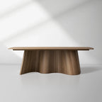 Table de salle à manger Cortina en forme de bateau, en noyer américain avec piètement ondulé