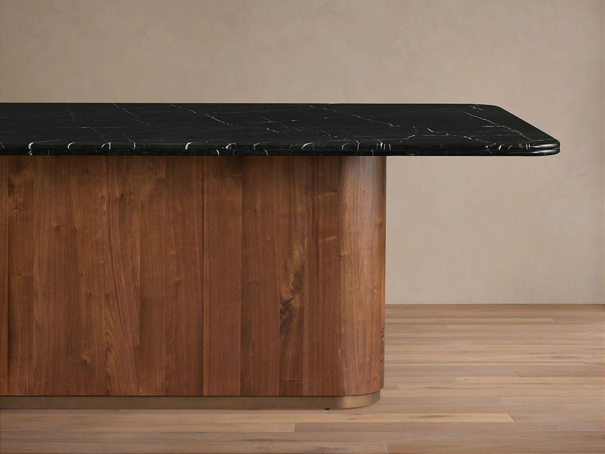 Table à manger Caden avec plateau en pierre Marquina noire Base en noyer américain Style de luxe