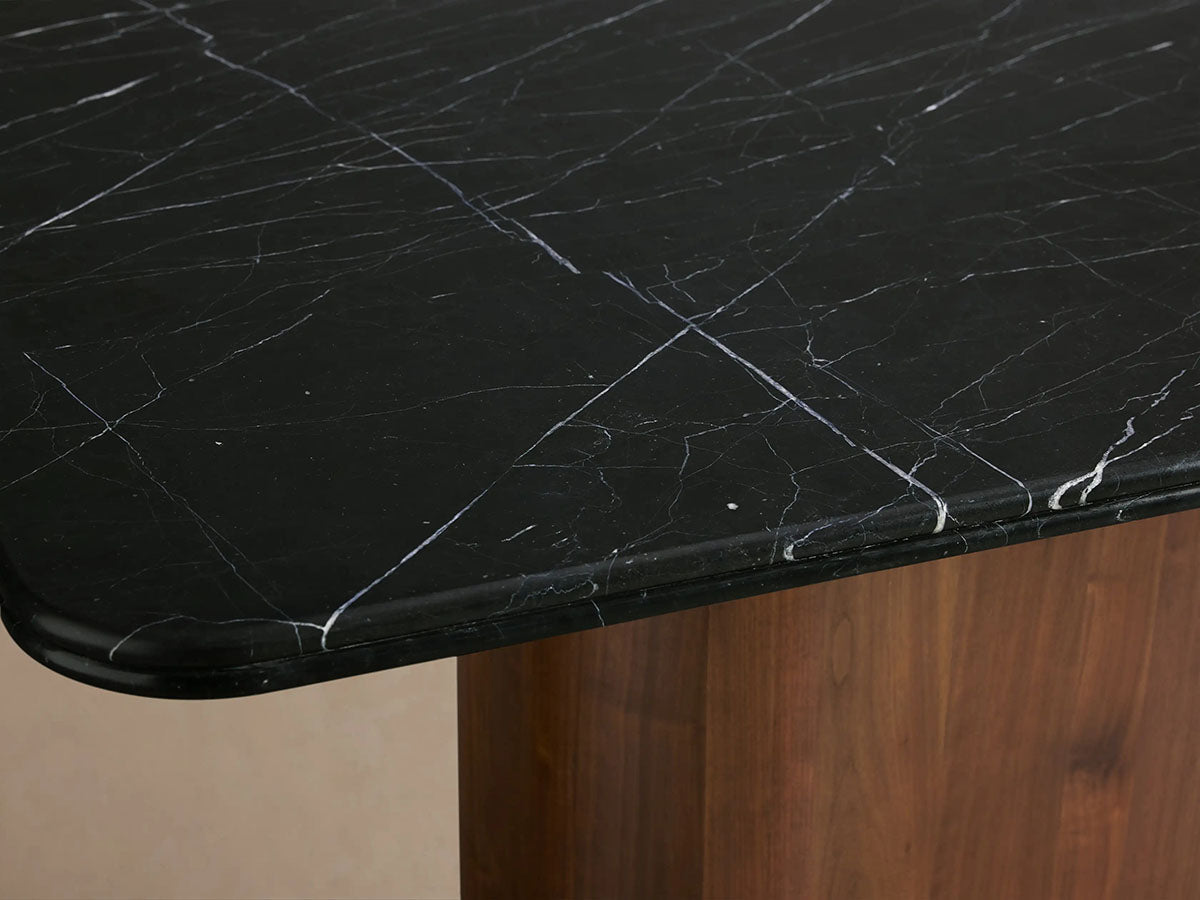 Table à manger Caden avec plateau en pierre Marquina noire Base en noyer américain Style de luxe