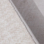 Tapis Melard lavé doux, motif abstrait neutre, sensation de détente et texture rétro, style moderne et doux.